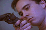 Bobby checks his gun in KILLERS EROTICUS
